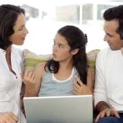 Child between parents trying to understand divorce