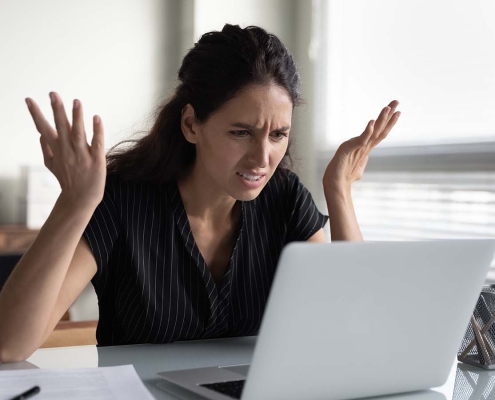 Parent annoyed at written co-parenting communication on computer
